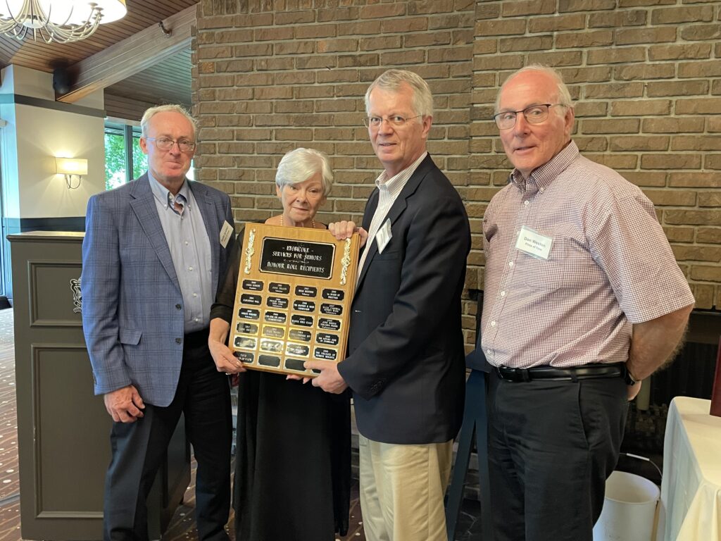 Members of the Pints of View men's volunteer group accepting the ESS Honour Roll Award from ESS Board Member Donna Cansfield